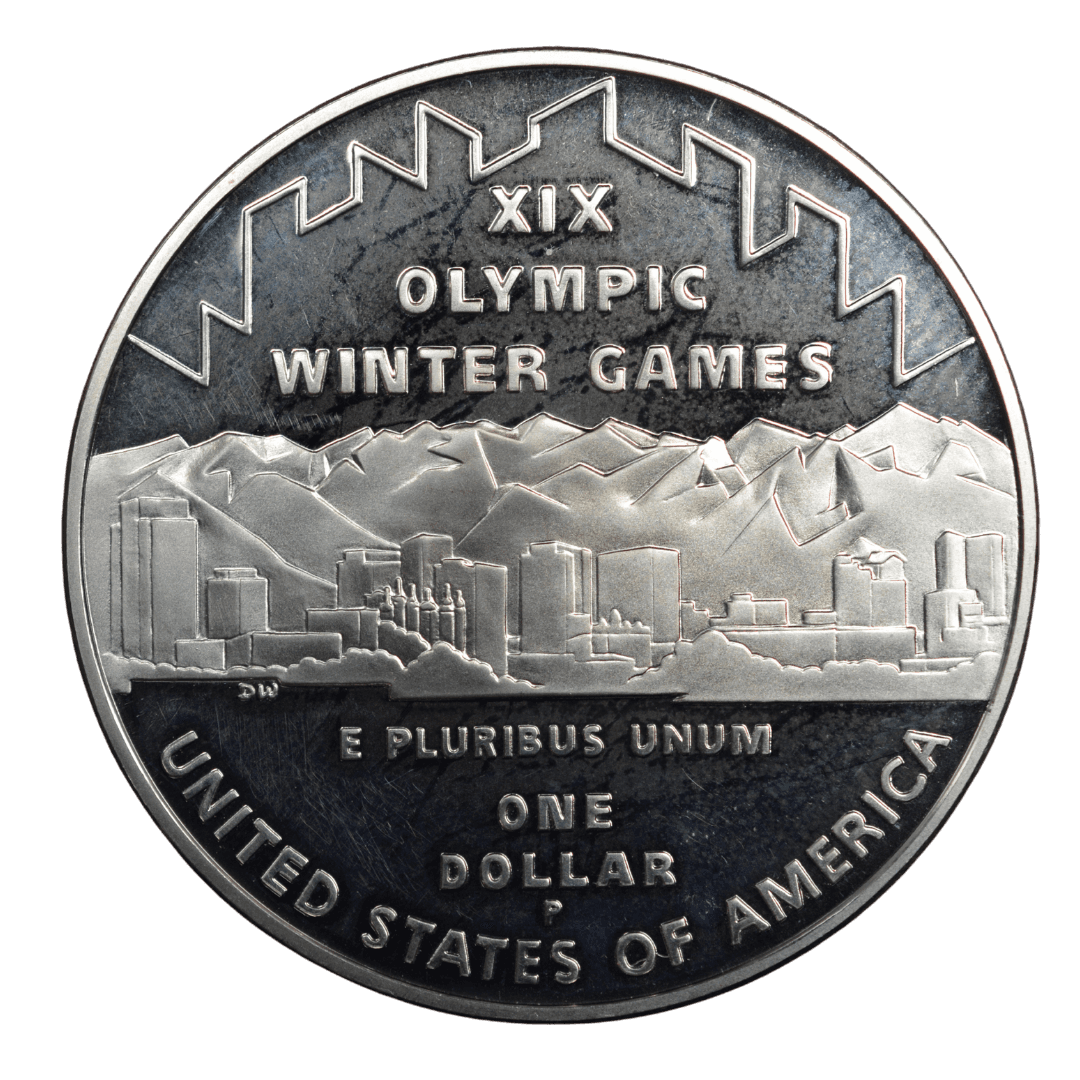 1 доллар (Commemorative Silver Dollar)
США
Филадельфия (P)
серебро 0.900 (MS/BU по фото)
26.73 г + 24.057 г чистого серебра (ASW 0.7734 oz)
142 297
Памятная монета к XIX зимним Олимпийским играм в Солт-Лейк-Сити (2002) — одна из двух монет (серебряный доллар + пятидолларовая золотая)
2002 год, относительно редкая для современных коммеморативов США (малый тираж, rarity index ~33 по Red Book/Numista)