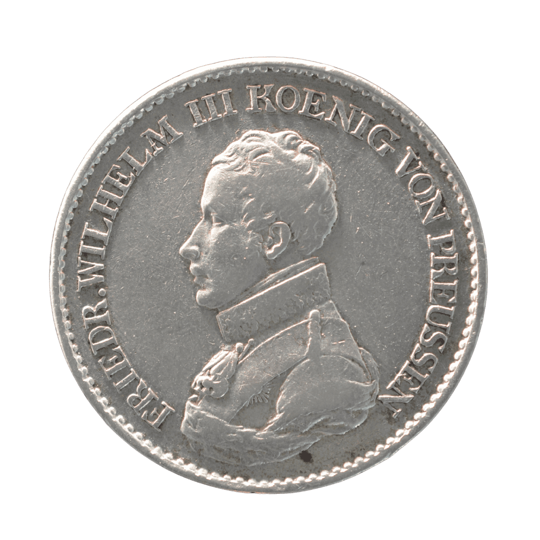 1 талер 1818 D, Королівство Пруссія

Характеристики:

* Номінал: 1 талер
* Рік: 1818
* Країна: Королівство Пруссія
* Регіон (якщо є):
* Правитель: Фрідріх Вільгельм III
* Монетний двір: Дюссельдорф (позначка D)
* Метал: срібло
* Проба: 750
* Вага: 22,272 г
* Діаметр: 34,5 мм
* Товщина:
* Гурт: напис «GOTT MIT UNS»
* Тираж: невідомо
* Каталожний номер: KM# 396