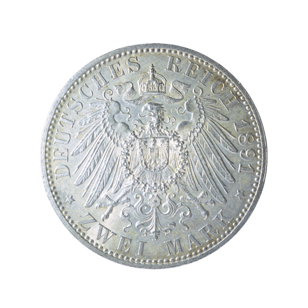 2 марки, Ольденбург, 1891

Характеристики:

* Країна: Німецька імперія
* Державне утворення: Велике герцогство Ольденбург
* Номінал: 2 марки
* Рік: 1891
* Правитель: Ніколаус Фрідріх Петер II
* Монетний двір: Берлін (A)
* Метал: срібло (900)
* Маса: 11,11 г
* Діаметр: 28 мм
* Гурт: рифлений
* Тираж: 100 000 шт.

Опис:
Срібна монета Великого герцогства Ольденбург, викарбувана за правління великого герцога Ніколауса Фрідріха Петера II. На аверсі зображено його портрет із написом NICOLAUS FRIEDR. PETER GR. H. V. OLDENBURG («Ніколаус Фрідріх Петер, великий герцог Ольденбурзький»). На реверсі розміщено імперського орла Німецької імперії під короною з написом DEUTSCHES REICH («Німецька імперія») та номіналом ZWEI MARK («Дві марки»). — фото 2