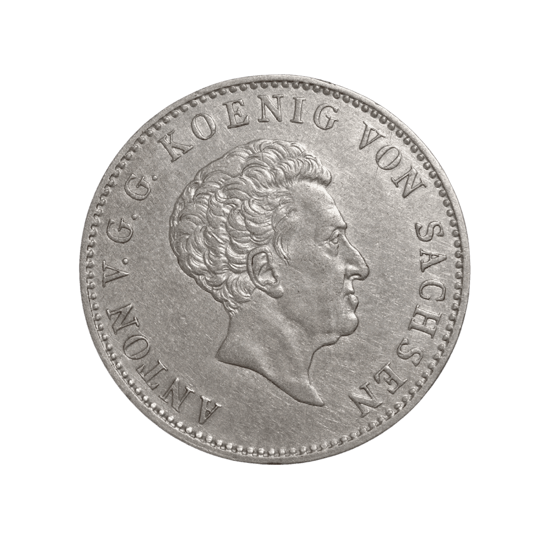 1 талер 1833 G, Королівство Саксонія, король Антон

Опис:

На аверсі зображено погрудний портрет короля Антона, обернений праворуч, з легендою ANTON V. G. G. KOENIG VON SACHSEN (Антон, Божою милістю король Саксонії).

На реверсі — коронований герб Королівства Саксонія в дубовому вінку. Навколо герба розміщено напис ZEHN EINE FEINE MARK (Одна десята кельнської марки чистого срібла). Під гербом — літера G, що позначає Дрезденський монетний двір, та дата 1833.  

Характеристики

* Номінал: 1 талер
* Рік: 1833
* Країна: Німецькі держави
* Держава: Королівство Саксонія
* Правитель: Антон (1827–1836)
* Тип: Обіговий талер
* Монетний двір: Дрезден (G)
* Метал: Срібло
* Проба: 833
* Вага: 28,063 г
* Діаметр: 37 мм
* Каталожні номери: Jaeger 60; AKS 66; Davenport 867; KM 1120; Thun 309
* Тираж: 189 605 шт.
* Гурт: GOTT SEGNE SACHSEN (Боже, благослови Саксонію).  

Примітка

Цей талер карбувався за стандартом «Zehn eine feine Mark», тобто з однієї кельнської марки чистого срібла виготовляли десять таких монет. Випуск належить до останніх регулярних талерів періоду правління короля Антона і є класичним типом саксонської срібної монети першої половини XIX століття.  

Рідкість

Нечаста.

Тираж 1833 року був помітно меншим, ніж у більшості сусідніх років цього типу (1832, 1834–1836), тому саме випуск 1833 G зустрічається рідше серед колекціонерів.