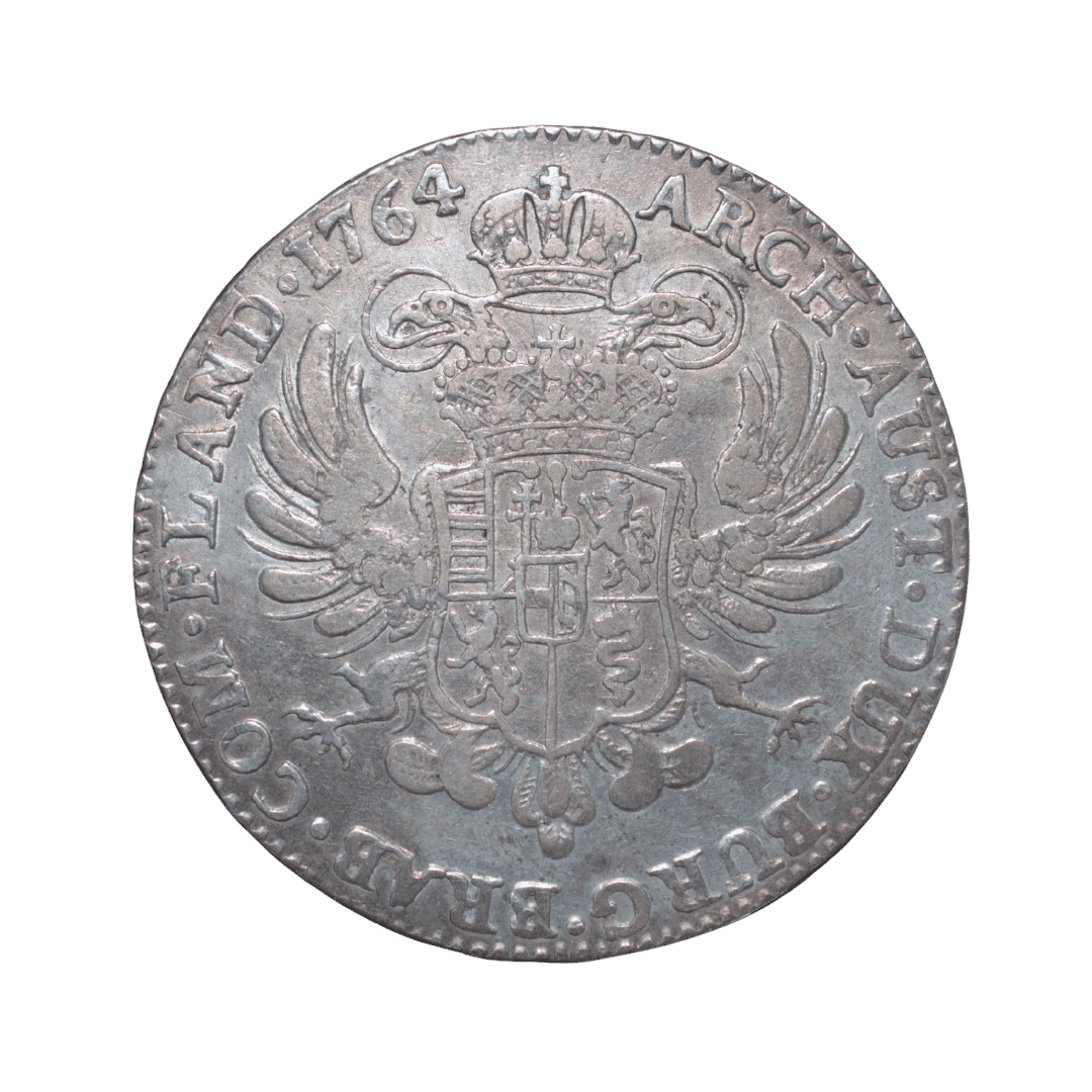 1 Kronenthaler (Couronne), 1764, Мария Терезия. МД — Bruxelles (Брюссель) ✅
Тип: Кроненталер, Австрийские Нидерланды (Брабант), серебро
Основные характеристики:
— Страна: Австрийские Нидерланды (Brabant)
— Номинал: 1 Kronenthaler / Couronne
— Год: 1764
— Правитель: Мария Терезия (Maria Theresia, 1740–1780)
— Материал: Серебро 873/1000 (0.873)
— Вес: 29.44 г
— Диаметр: 41 мм
— Монетный двор: Bruxelles (знак — голова ангела)
— Тираж: 1 868 021 шт.
На что обратить внимание:
Аверс — бургундский крест (Andreaskreuz) с четырьмя коронами. Реверс — двуглавый орёл с гербом. Гурт: JUSTITIA ET CLEMENTIA. — фото 2